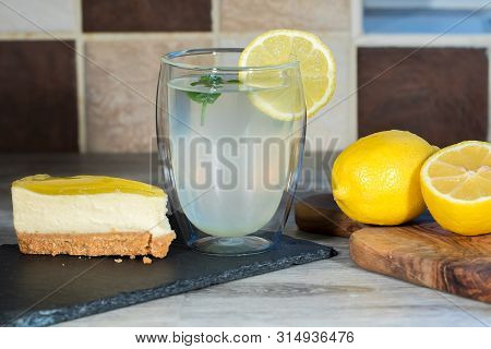 Lemon Cheesecake. Authentic Freshly Prepared Home-made Organic Lemonade. Summer Food. Cool Glass Of 