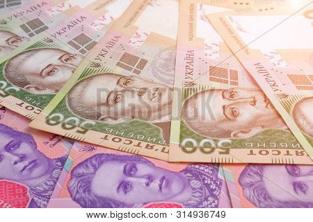 Pile Of Ukrainian Banknotes Value Of 500 And 200 Hryvnia Uah As Background.