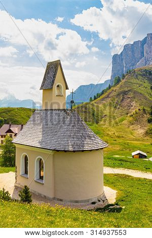 San Maurizio Chapel On The Passo Di Val Gardena With Mountain View In Background. Colorful View In P