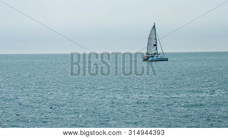 St Helier, United Kingdom, - 07, 25, 2019: View From The Sea Of A Catamaran Carrying Tourists
