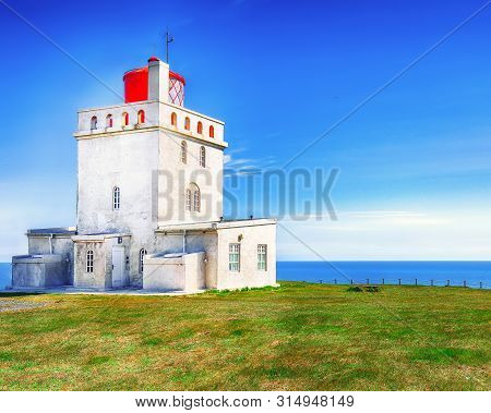 Landscape With White Lighthouse At Cape Dyrholaey. 
Location: Cape Dyrholaey (cape Portland), Near V