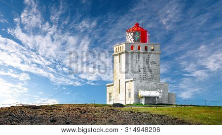 Landscape With White Lighthouse At Cape Dyrholaey. 
Location: Cape Dyrholaey (cape Portland), Near V