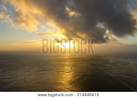 Sunset At Cape Reinga, New Zealand Where Currents Collide.
