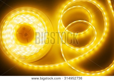 Bright Yellow Led Strip, Diode Strip, A Coil  Of Silicone Strip Close-up