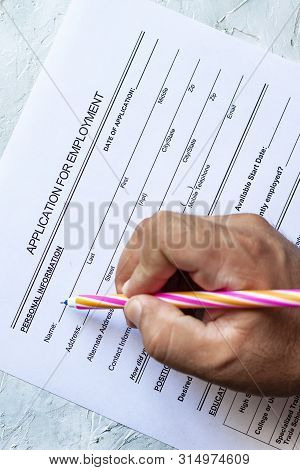 Hand Filling Standard Application For Employment. Hr, Hiring, Applicant Filling Job Application. Hr,