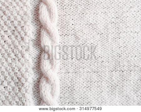 Texture Of White Knitted Woolen Sweater. Winter Seadon Background