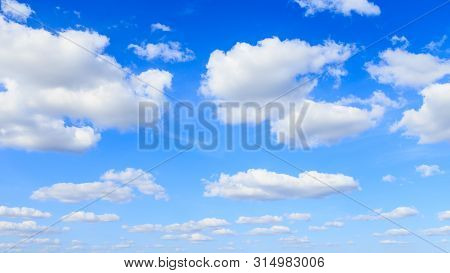 Blue Sky Background And White Clouds In Sunny Day