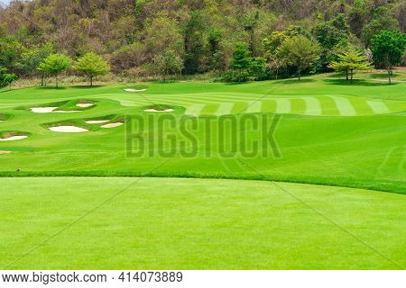 Golfcourse, Beautiful Landscape Of A Golf Court With Trees And Green Grass