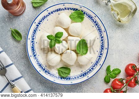 Mozzarella Cheese With Basil In White Ceramic Plate, Tomato Cherry Olive Oil And Spice Grinder, Cond