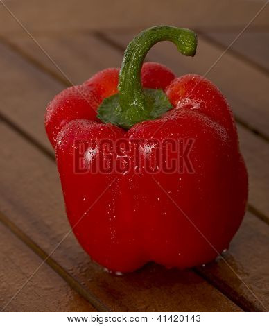 Wet Red Paprika On The Table