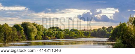 Summer Landscape With River And Picturesque Sky During Sunset. Trees On The Shore
River. Panorama