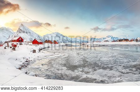 Picturesque Morning View Of Torsfjorden Fjord With Fredvang  Village And Snowy Mountain Peaks At Bac