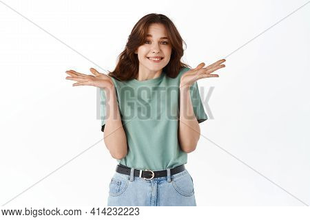 Oops Sorry I Have No Idea. Smiling Cute Young Woman Shrugging Shoulders With Cute Smile, Know Nothin