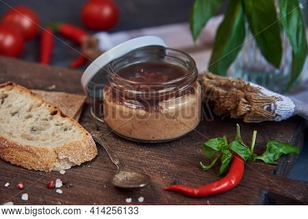 Homemade Berry And Tomato Sauce In A Glass Jar On A Wooden Board.