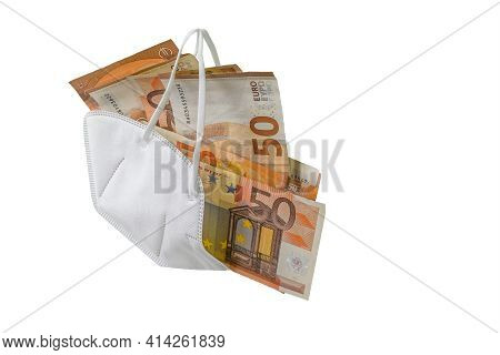 Medical Ffp2 Face Mask Against Covid-19 Virus Filled With Euro Banknotes, Concept For Enrichment By 
