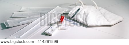 Covid-19 Rapid Antigen Self Test For Diagnostic At Home And A Ffp-2 Mask On A Light Gray Background,