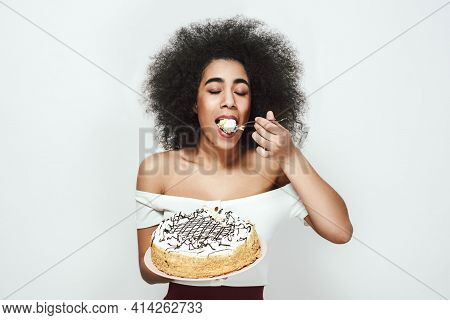 So Tasty Satisfied Happy Young Afro American Woman With Curly Hair Is Eating Her White Birthday Cake