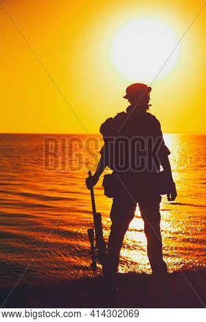 Silhouette Of Army Commando Fighter, Navy Seals Team Sniper Or Coast Guard Soldier Standing On Sea S