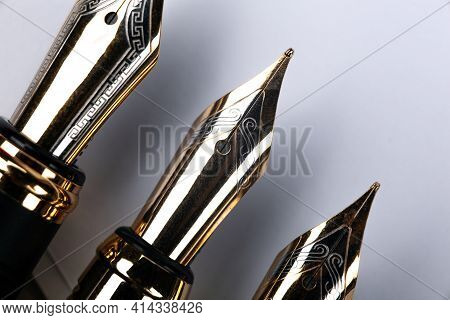 Gold Plated Fountain Pens Closeup On The Table