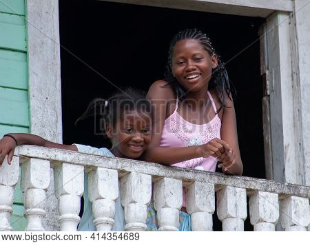 Darien Province, Panama. 07-18-2019. Afro-descendent Female Adolescent And Small Sister At The Balco