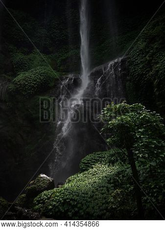 Closeup Of Sekumpul Waterfall Cascade Cataract In Tropical Lush Green Jungle Rainforest Landscape Sa