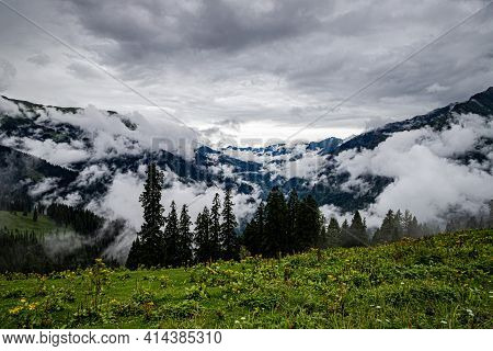 Mesmerizing View Of Clouds In Himachal Pradesh,with Fresh Green Meadows In Bloom.