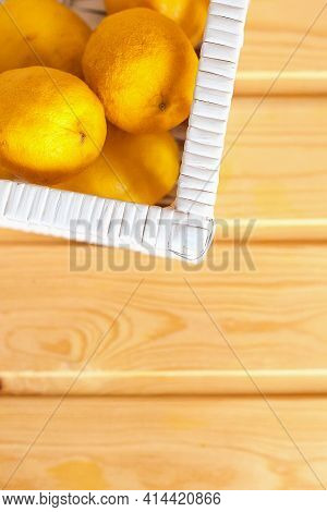 Fresh Lemon With Leaves. Lemon Tree. Box Of Yellow Lemons With Fresh Lemon Tree Leaves On Wooden Bac