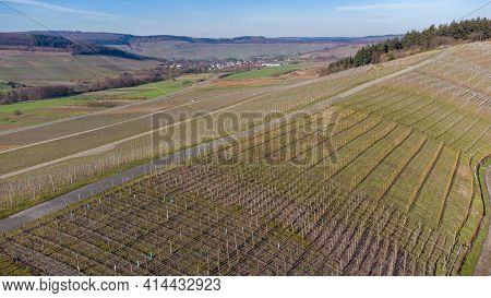 Aerial View Of The River Moselle Valley With Vineyards And The Village Osann-monzel In The Backgroun