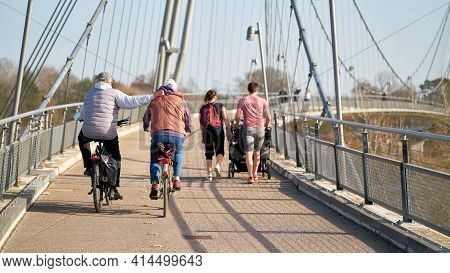 Magdeburg, Germany - February 25, 2021: Bicyclists And Walkers On The Herrenkrugsteg Suspension Brid