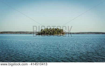 Single Small Uninhabited Island With Trees In The Archipelago Of Stockholm. Sweden. Water Landscape