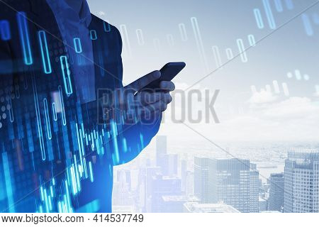Businessman In Formal Suit Is Serfing The Information About Stock Market Behavior Using Smartphone. 
