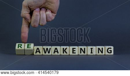 Reawakening Symbol. Businessman Turns Cubes And Changes The Word 'awakening' To 'reawakening'. Beaut