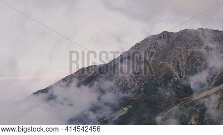 Koscielec From Kasprowy Wierch. Mountain Covered In The Clouds. High Quality Photo
