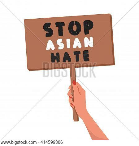 Woman\'s Hand Holds A Banner With The Message: Stop Asian Hate. A Symbol Of Protest Against Racism. 