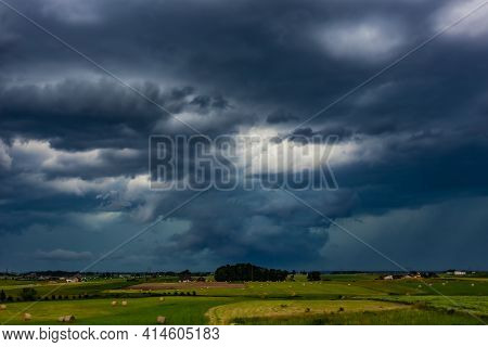 Supercell Storm Clouds With Wall Cloud And Intense Rain
