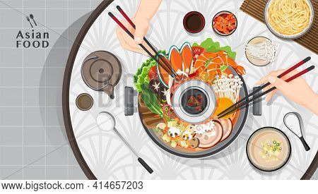 Shabu Shabu And Sukiyaki In Hot Pot At Restaurant,  Hand Holding Chopsticks Eating Shabu  Shabu