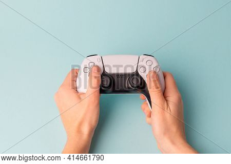 Videogame Console Wireless Gamepad. Blue Background. Minimal Style. Modern Leisure At Home.