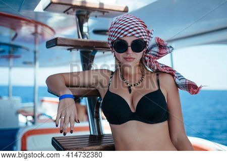 Beautiful Ginseng In A Swimsuit And Arafat On Board The Ship. Concept Boat Trips