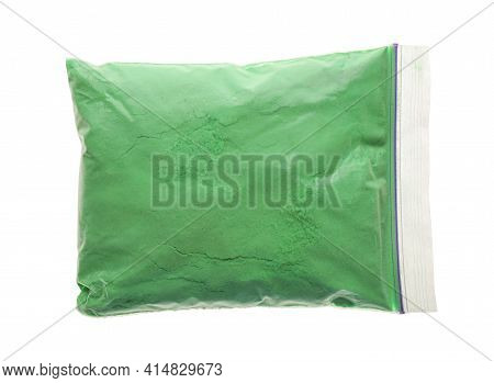 Green Powder In Plastic Bag Isolated On White, Top View. Holi Festival Celebration