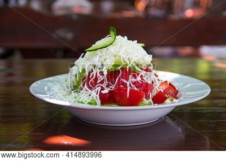 Traditional Bulgarian Salad - Shopska Salad Served On Table