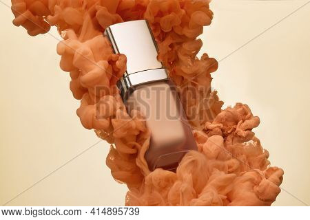 Bottle Of Foundation And Ink Splash In Water