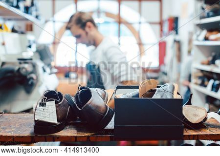 Shoemaker or cobbler in his traditional workshop