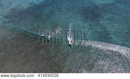 Surfers Taking Wave Turquoise Water Aerial Shot