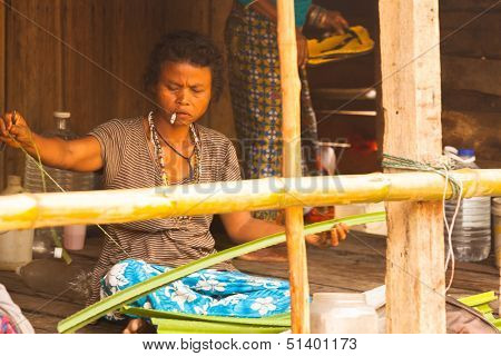 BERDUT, MALAYSIA - APR 8: Unidentified woman Orang Asli in his village on Apr 8, 2013 in Berdut, Malaysia. More than 76% of all Orang Asli live below the poverty line, life expectancy - 53 years old.