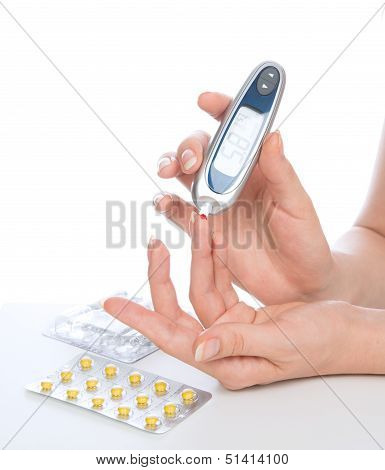 Diabetes Patient Measuring Glucose Level Blood Test With Glucometer