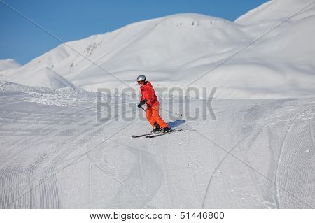 Skier is posing at camera at Gudauri resort in high mountaing of Georgia Caucasus