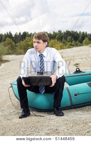 Dressed Man Sit On Boat Edge