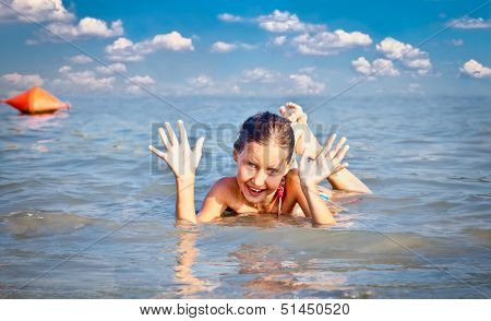  Girl on the public beach Strand at Danube river in Novi Sad, Serbia.