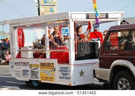 HASTINGS, ENGLAND - AUGUST 10: Miss Hastings,Bethany Hill (centre), takes part in the Old Town Carnival parade on August 10, 2013 in Hastings, East Sussex. The annual event was first held in 1968.