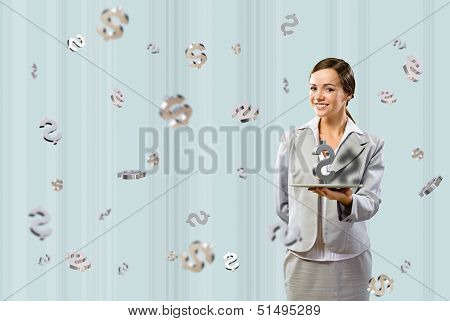 business woman smiling and holding a table